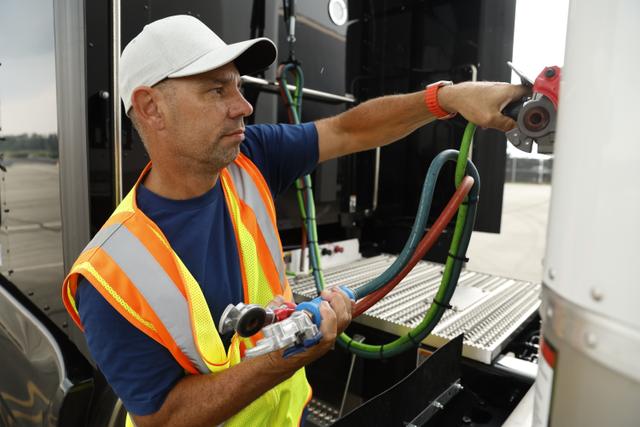 Stack AV employee making sure a truck is ready to be driven